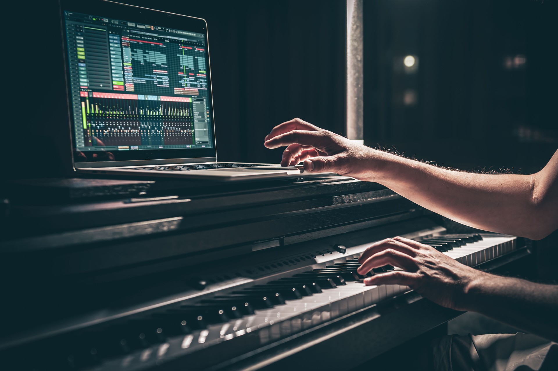 A man composer, producer, arranger, songwriter, musician hands arranging music.